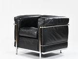 an image of a black leather chair on a white background