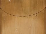an image of a piece of wood with a piece of paper on top of it