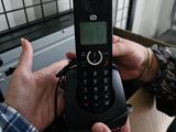 a man that is holding a cell phone in his hand