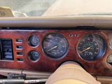 a close up of a dashboard of a car with various gauges