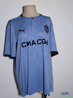 the shirt is blue and has black letters on it