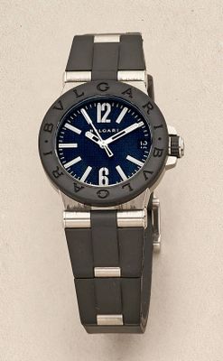 a close up of a wrist watch on a white surface