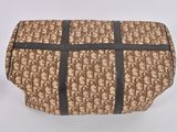 beige and black bag with a black stripe on the bottom