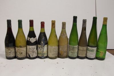 bottles of wine are lined up in a row on a table