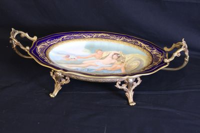 a close up of a plate on a stand on a black background