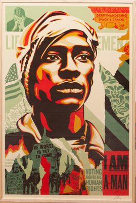 poster of a man with a turban on his head in front of an american flag