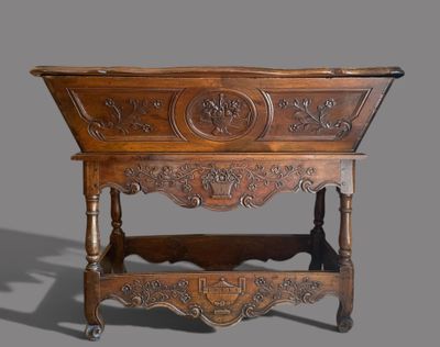 a wooden table with carvings on the top of it