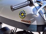 a close up of a motorcycle parked on the side of the road