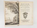 an open book with a drawing of a landscape and a tree