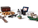 a small assortment of religious items on a white surface