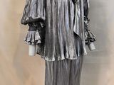 an image of a mannequin dressed in silver with ruffles on it