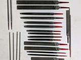 a lot of knives that are laying out on the table