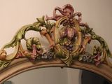 a mirror that has a picture of a flower on it