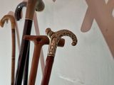 three canes that are standing up against a wall
