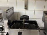 an image of a commercial fryer in a commercial kitchen