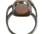 an image of a silver ring with a pink stone in it