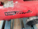 a red fire extinguisor sitting on a pallet