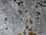 a close up view of a metal plate with a lot of dirt on it