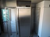a picture of a commercial kitchen with a refrigerator and a freezer