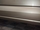 a close up of a car door with the door handle down