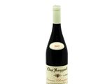 the bottle of wine is sitting on a white surface