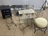 a glass table with a stool and a stool on it