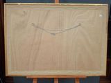 an easel with a drawing of a smiling face on it
