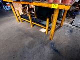 a table with pots and pans on it in a warehouse