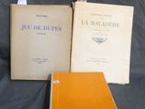 two books sitting on top of a table next to each other