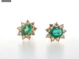 an image of a pair of emerald and diamond earrings
