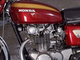 a red motorcycle that is parked in a garage