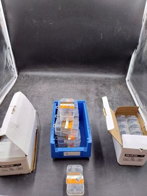 many boxes of medicine sitting on the floor next to each other