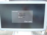 a computer monitor that is sitting on top of a table
