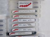 several pens are lined up in a plastic case with labels