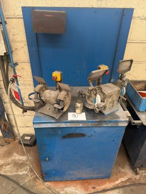 two machines that are sitting on a blue table