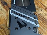 a close up of a video card sitting on top of a wooden table