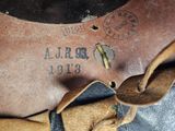 a close up of a leather bag with a label on it