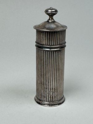 an antique silverplated salt shaker with a domed top