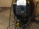 an image of a welding machine in a garage