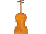 an old violin with a wooden back and bow on a white background