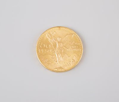 a gold coin on a white surface with a white background