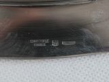 a close up of a silver plate on a table