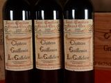 three bottles of wine sitting next to each other on a table
