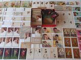 a lot of cards on a table with a box of them