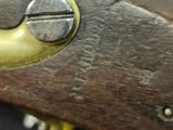 a close up of a gun that is on a table