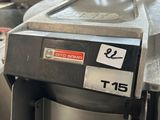 a machine that has a banana on it in a kitchen