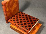 an image of a wooden box with a book on top of it