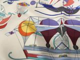 a close up of a shirt with a pattern of boats on it