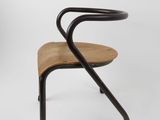 a wooden chair with black legs and a curved seat