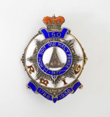 a close up of a badge on a white surface
